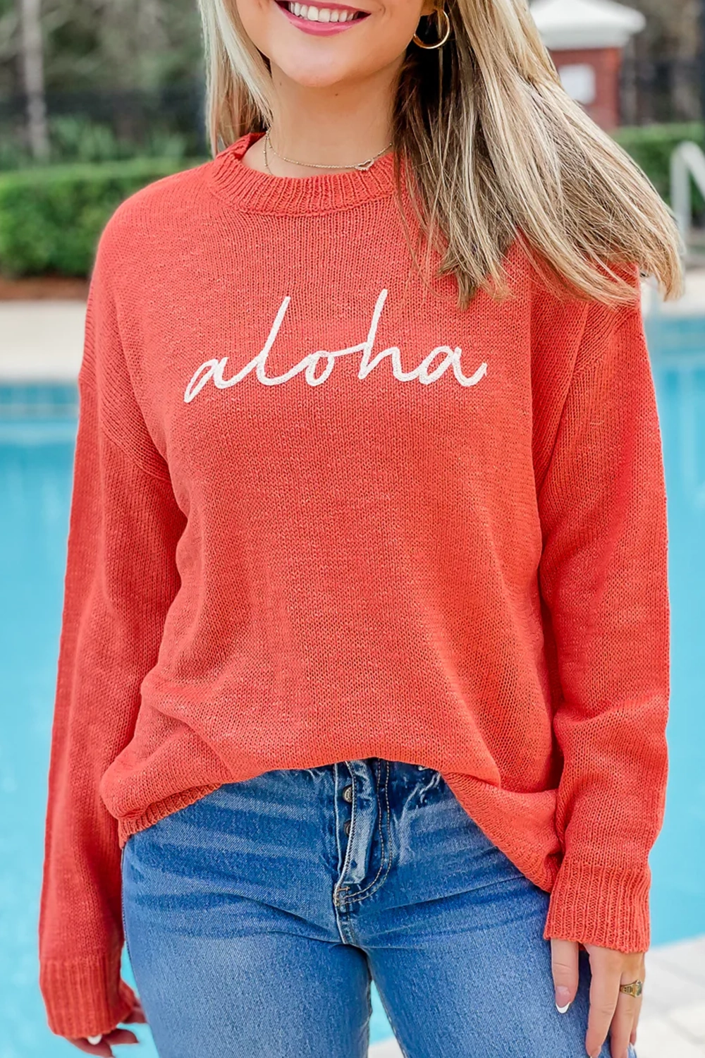 Red and orange letter sweater