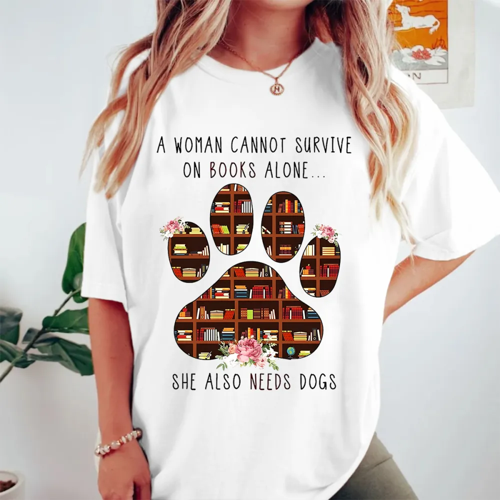 A Woman Cannot Survive On Books Alone She Also Needs Dogs Graphic Tee