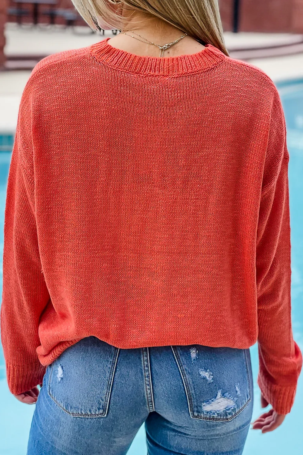 Red and orange letter sweater